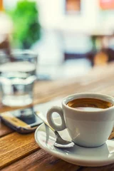 Kissenbezug Coffee. Cup of coffee mobile phone on table on restaurant coffee house terrace. Coffee break business © weyo