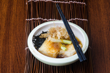 japanese cuisine. fried tofu on the background