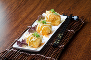 japanese cuisine. fried tofu on the background
