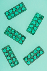 top view of medicines isolated on green backdrop