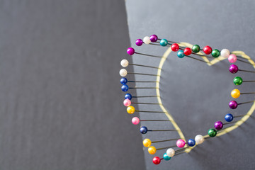 Heart shape from colored pins.