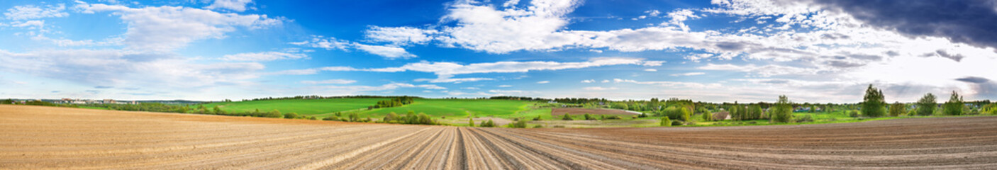 spring panorama of landscape with ploughed field