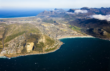 Fototapeta premium Aerial view of Fish Hoek Valley and Clovelly, Cape Town, South Africa. Also visible is Glencairn on the left and over the top is Noordhoek Beach and Chapman's Peak in the distance.
