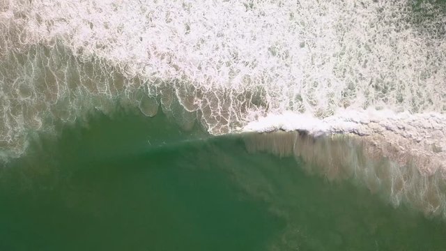 Aerial of waves breaking on the shore
