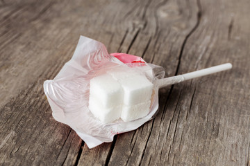 Lollipop with very high sugar content. Sugar instead of candy is harmful to health. Wooden...