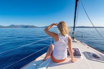 Young woman enjoying a yacht trip in the Mediterranean Sea