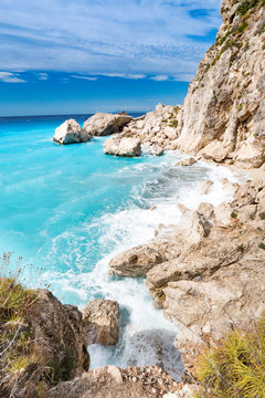 Lefkada Island cliffs with rough sea and clear bluew waves