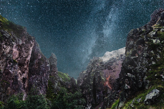 Milky Way in the background of a picturesque night mountain landscape