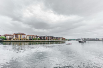 Nervion river with boat rowing