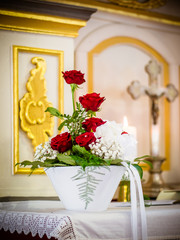 The red roses bridal bouquet on the altar in the church