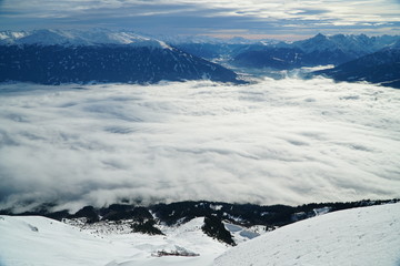 View over the Inn Value with Innsbruck hidden below clouds