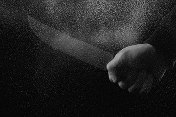 Fototapeta na wymiar black and white photo with glitches of man holding knife