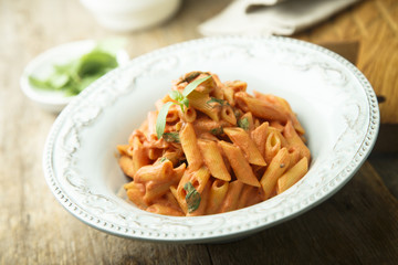 Pasta with tomato, cream and basil