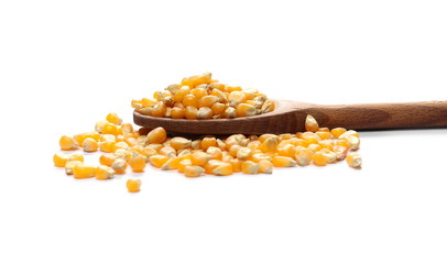 Yellow grain corn in wooden spoon isolated on white background, for popcorn
