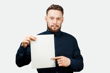 Portrait of handsome adult man isolated on white background. Caucasian man holds piece of paper