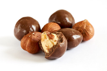 Chocolate balls filled with hazelnuts isolated on white background