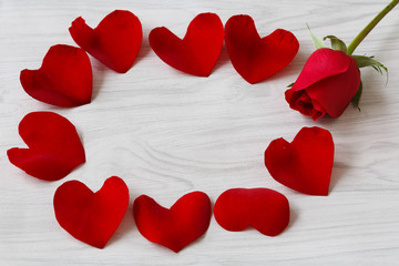 heart shaped rose petals and woody background