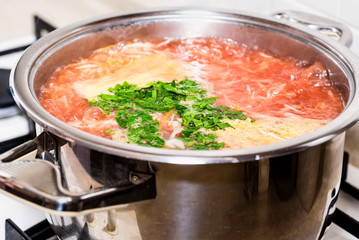 Adding chopped greens to vegetable soup