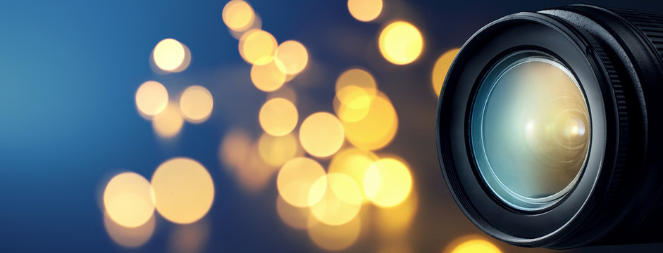 Camera lens with bokeh lights background