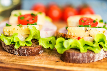 Sandwiches with cheese, turkey, lettuce and tomato