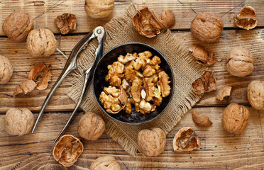 Fresh walnuts on an old wooden table