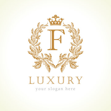Luxury F letter and crown monogram logo. Laurel elegant beautiful round identity with crown and wreath. Vector letter emblem F for Antique, Restaurant, Cafe, Boutique, Hotel, Heraldic, Jewelry
