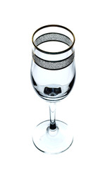 empty glass of wine with gold rim on white background (isolate).