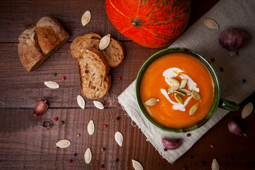 Pumpkin soup on wooden