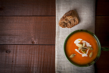 Pumpkin soup on wooden