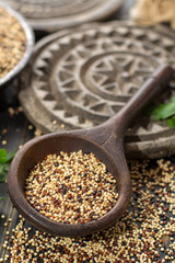 Mix of organic white, yellow and black quinoa, dietary and healthy food