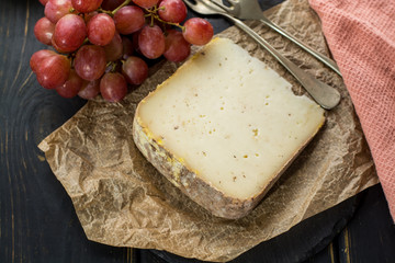 Tasting of ancient french demi soft cheese Tomme from French Alps, made from cow, goat or sheep...