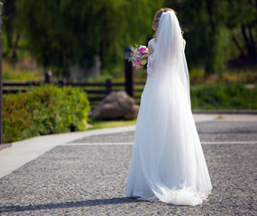 Fototapeta na wymiar The bride goes alone on her wedding day