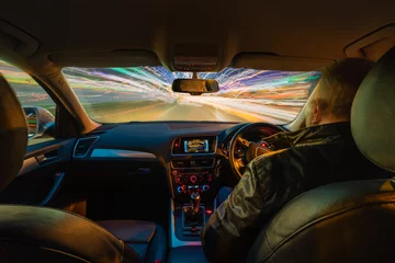 Printed kitchen splashbacks Fast cars Car Interior Light Trails at Night / Multiple light trails creating dynamic action from the interior of a car at night