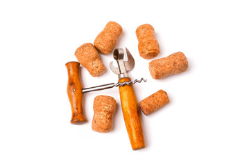 Several wine corks, vintage bottle opener and corkscrew isolated on white background