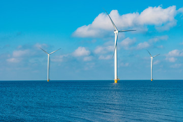 Offshore Windmill farm in the ocean  Westermeerwind park , windmills isolated at sea on a beautiful...