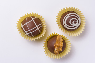 Homemade chocolate truffle.  Flat lay design of candy ball. Macro, close up.