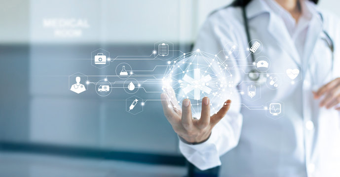Technology Innovation and medicine concept. Doctor and medical network connection with modern virtual screen interface in hand on hospital background