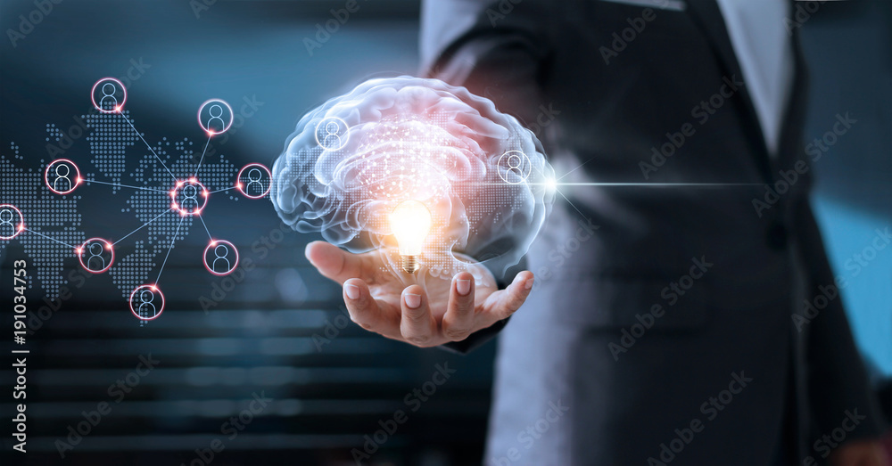 Poster  Businessman holding virtual brain and light bulb with global networking connection, brainstorm and business concept