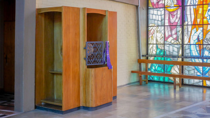 empty confessional in the church