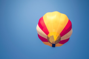 Colorful hot air balloon on a blue sky background