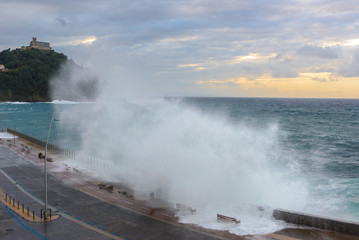 Fototapeta na wymiar Waves breaking on New Promenade of San Sebastian, Spain