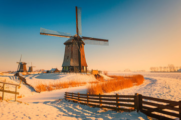 Winter landscape with windmills in Schermerhorn Netherlands