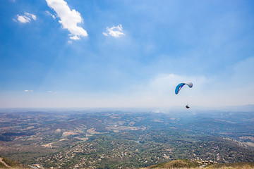 Belo Horizonte, Minas Gerais, Brazil. Paraglider flying from top of the world mountain