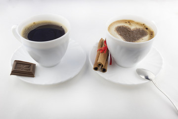 Two cups of coffee on a white background, cinnamon, chocolate