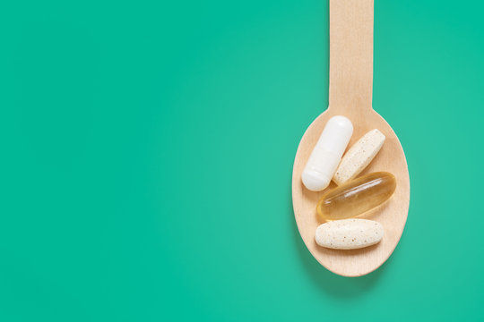 Wooden Spoon With Daily Dose Healthy Supplements