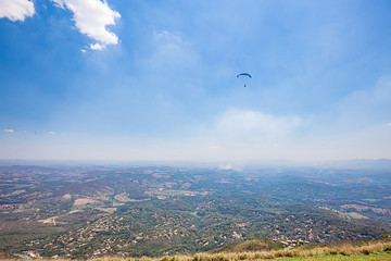 Belo Horizonte, Minas Gerais, Brazil. Paraglider flying from top of the world mountain
