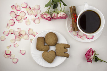 Love of cookies and coffee, rose petals