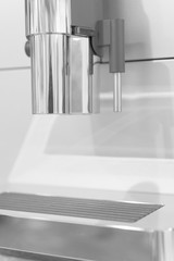 Detail of coffee machine in black and white