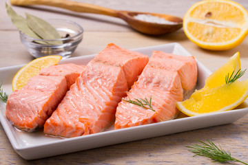 Boiled salmon on white plate. Poached salmon fillet. Good for health diet fish. horizontal