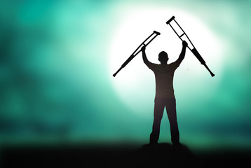 International Day of Persons with Disabilities (IDPD) concept: Silhouette a disabled man standing...